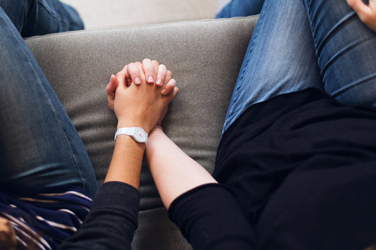 Image of a couple holding hands 